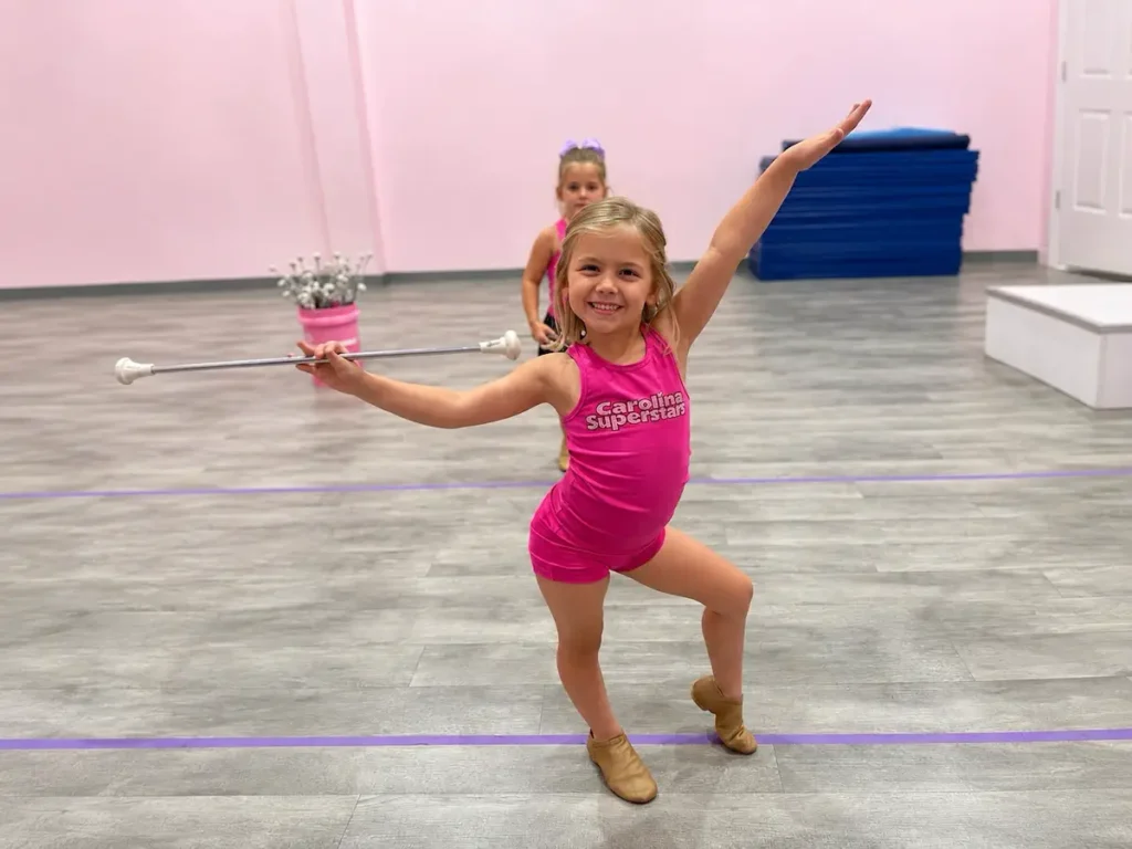 Young girl twirling baton at Carolina Superstars dance studio