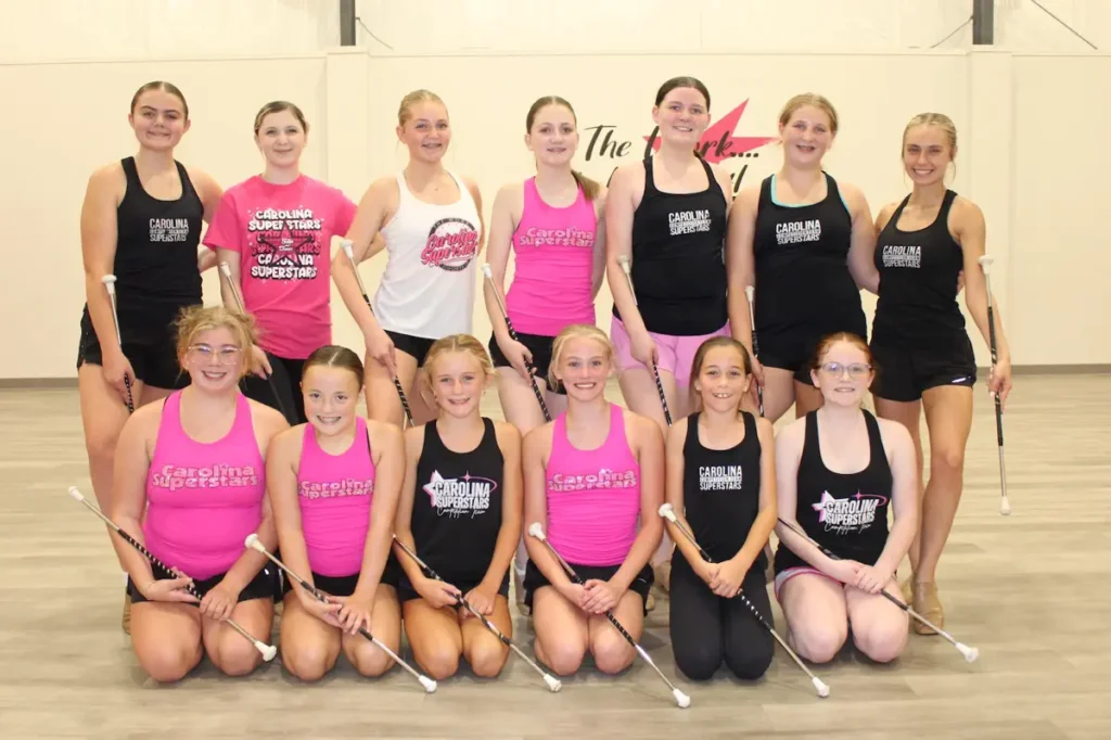 Carolina Superstars baton twirling team posing together indoors